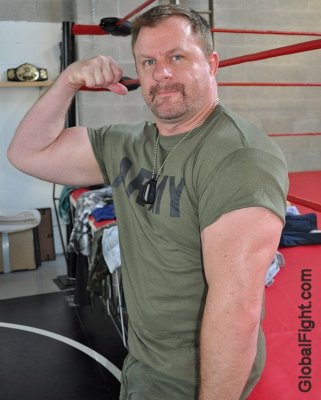 army man wrestler flexing big huge biceps muscles.jpg