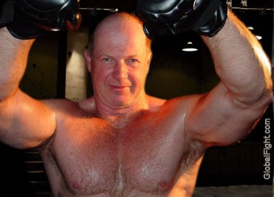 warehouse cage fighting matches hairychest bald man.jpg