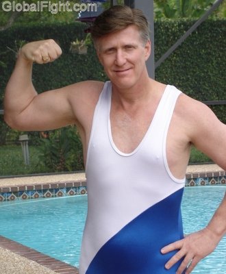 hot hubby posing wrestling singlet flexing biceps daddy poolside.jpg