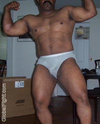 black man hairy chest flexing muscles.jpg