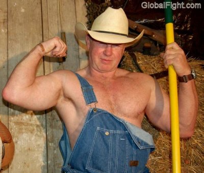 big cowboy working barn sweating shirtless hunky.jpg