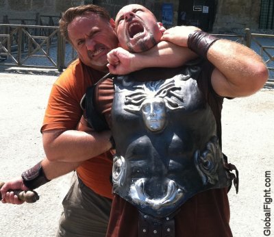 gladiators fighting to death match roman coliseum.jpg