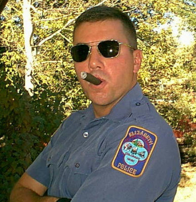 policeman smoking cigar state cop officer.jpg