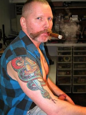 tattooed redneck whitetrash boy smoking cigar.jpg
