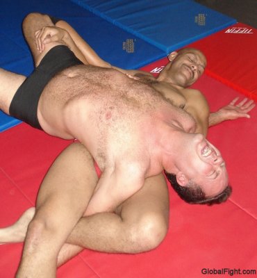 torturing hunky wrestler hairychest pecs arm pits.jpg