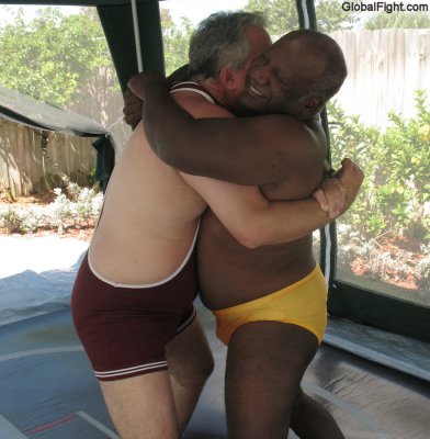 white versus black bearhugging daddies wrestling.jpg