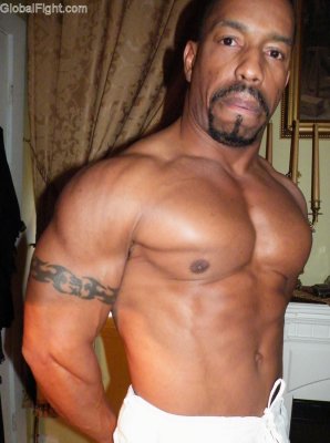 big tattooed biceps muscle tattoos ripped jock.jpg