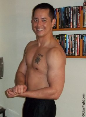 smooth army boy flexing muscles barracks self photos.jpg