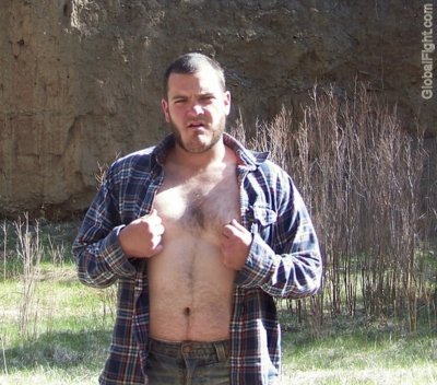 tough redneck man hiking woods opened shirt hairychest.jpg