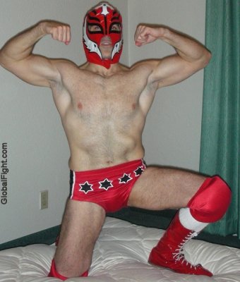 very hot musclejock pro wrestler posing flexing arms.jpg