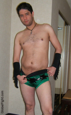 pro wrestler younger dude removing wrestling trunks shorts.jpg