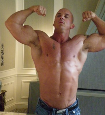 huge massive powerlifter strongman flexing bathroom mirror.jpg