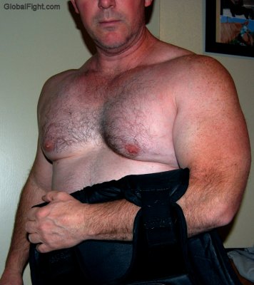 cowboy removing protective vest hairychest hot dude.jpg