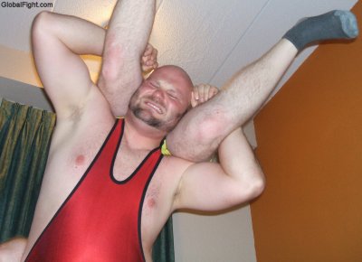 bearded burly gay bear daddy wrestler lifting helpless boy.jpg