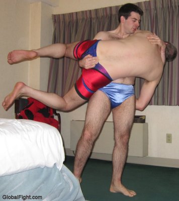 boy carrying daddy fireman lifting hotel room wrestling match.jpg