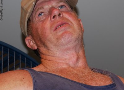 irish man wearing baseball cap hairychest.jpg