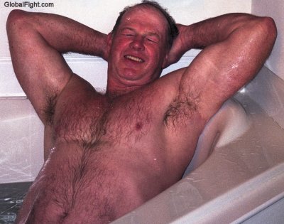 wet daddy sitting in bathtub soaking photos.jpg