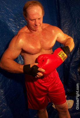 redheaded boxer putting on gloves gym workout.jpg