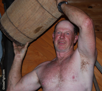 hard working man carrying barrels shirtless pics.jpg