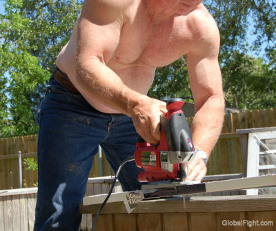 men working sawing wood construction site.jpg
