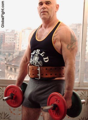 dad wearing weight lifting belt dumbell curls.jpg