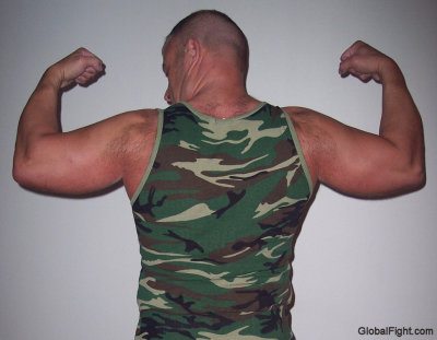 hairy shoulders army dad flexing big biceps.jpg