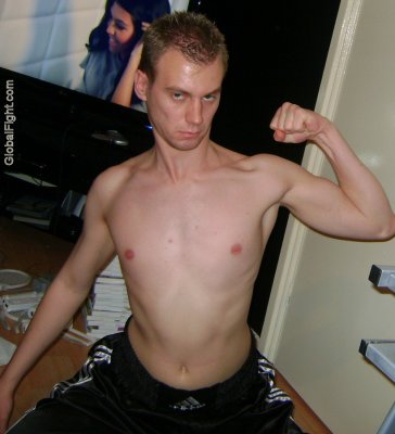 college dorm room preppie dude flexing skinny arms.jpg