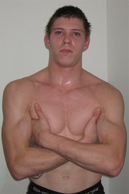 hot musclejock boy arms crossed lanky slender fighter.jpg