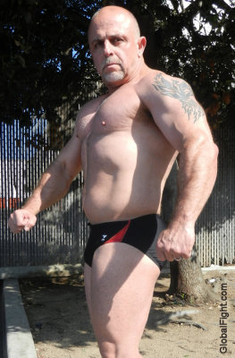 bald muscle biker trimmed chesthair tattoos speedos.jpg