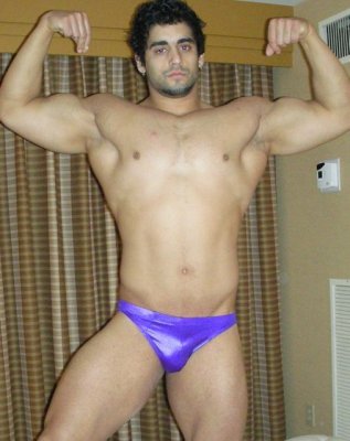 dark tanned tall gay male pro wrestler man.jpg