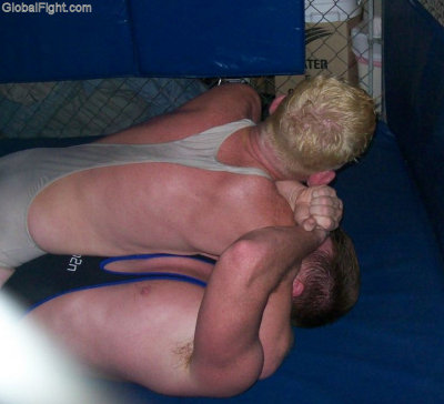 men wrestling cage match video taped event.jpg