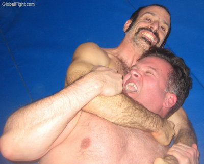 horny athletic musclejocks choking male wrestlers.jpg