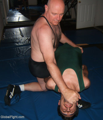 jock boy being dominated by strong heel wrestler.jpg