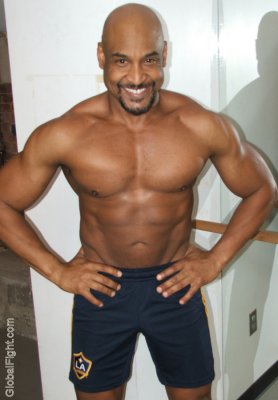 black muscleman arms on hips smiling.jpg