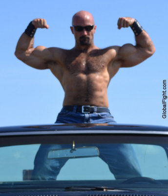 goatee leather muscleman flexing hard pecs.jpg