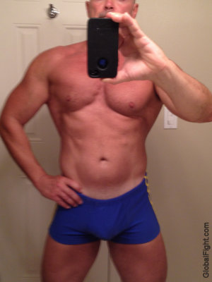 muscle dude wearing gym shorts.jpg