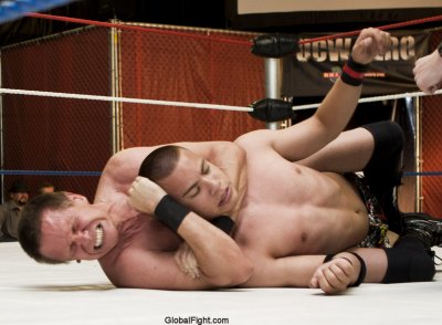 man straining to subdue opponent.jpg