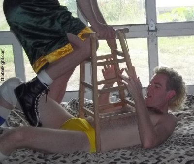 wrestler getting hit pinned chair.jpg