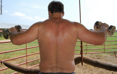 farmer dad lifting weights curls dumbells farm.jpg