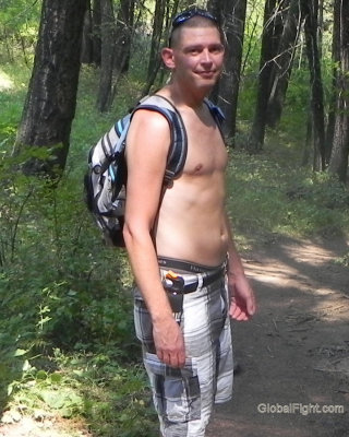 shirtless hiking boy walking woods trail.jpg