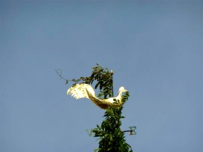 Ornate weather vane in courtyard