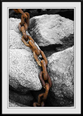 Rusted Chain over Stones