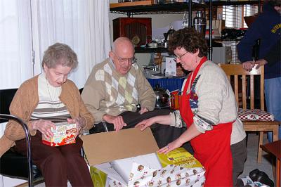 Parents opening their gift