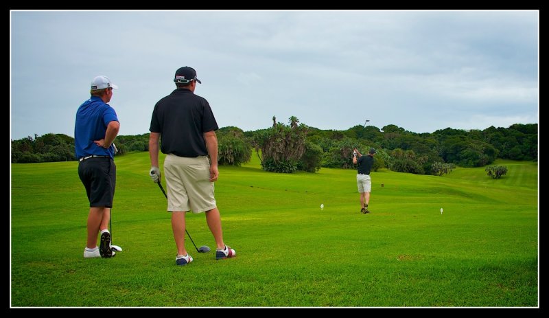 Mark tees off under the watch of our two pros Colin and Eric