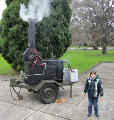 Hudson and the smoke oven (Wiles Cooker) used to prepare meals for the troops