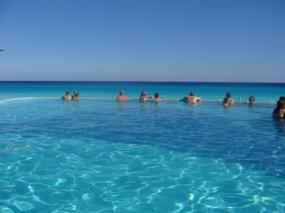 people relaxing in pool