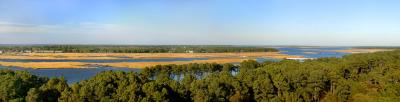 [NOVEMBER 2005] A panoramic view of eastern Chincoteague and western Assateague (the white bridge on the far left connects the two islands), from atop the Assateague Lighthouse. [To see a larger, more detailed panorama, click on original on the image's page and scroll left-and-right.]