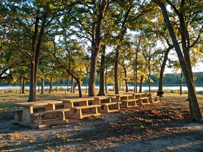 Groop picnic tables at sunset