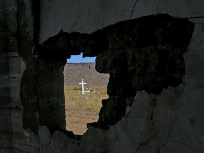 Cross through hole of abandoned church
