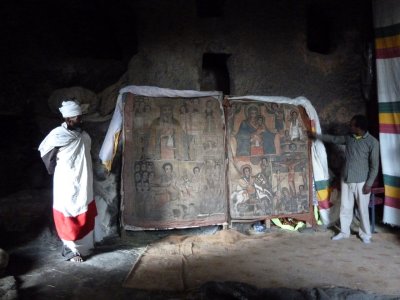 Cave church painting, priest and Lalibela guide
